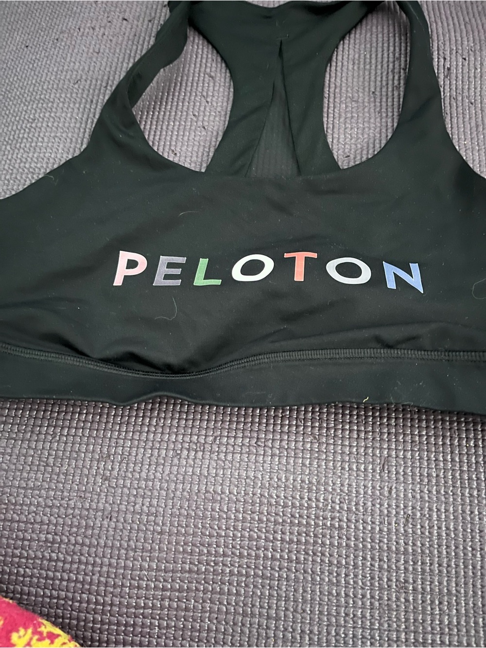 Peloton Black Racerback bra with Multicolor Logo size 10